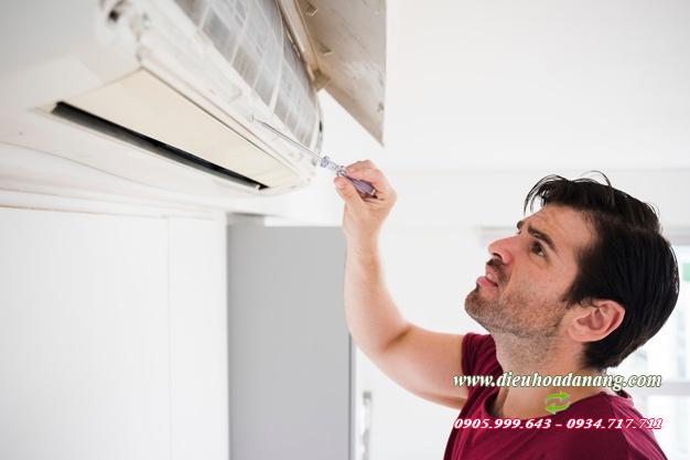 Premium Photo | Male electrician checking air conditioner through tester